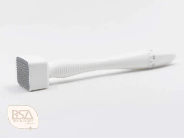 White derma stamp tool for microneedling treatment